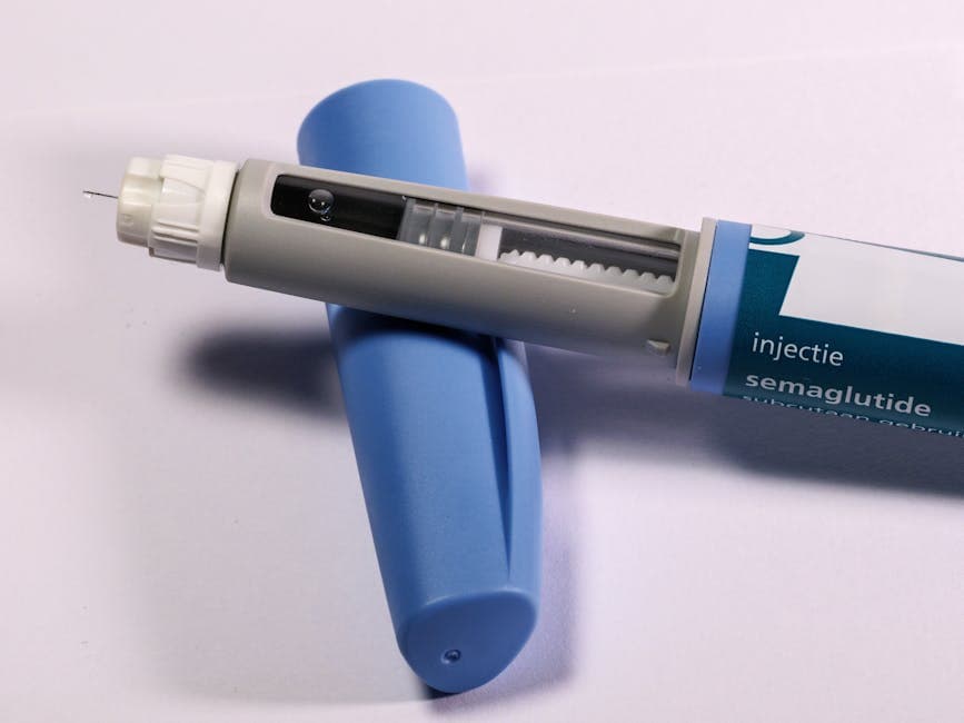 Close-up of a semaglutide injection pen held against the abdomen