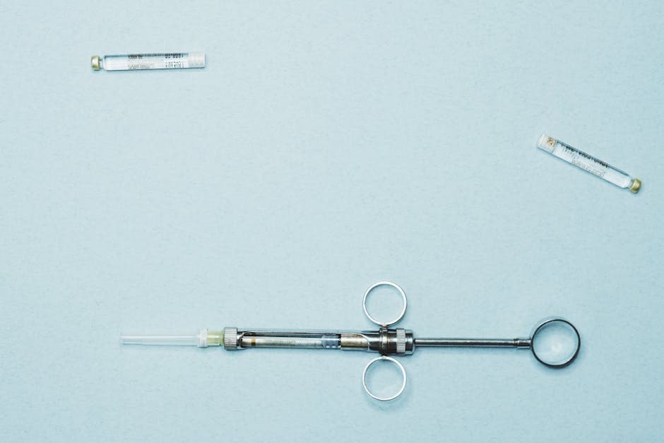 Close-up of a peptide vial and syringe on a clean medical surface