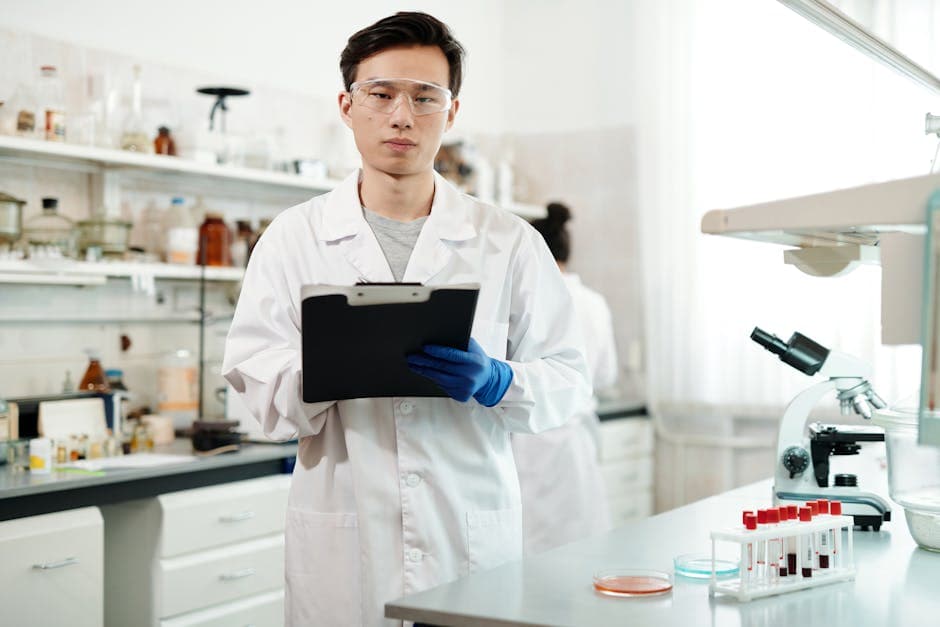 Laboratory researcher examining NAD+ molecular compounds under clinical conditions