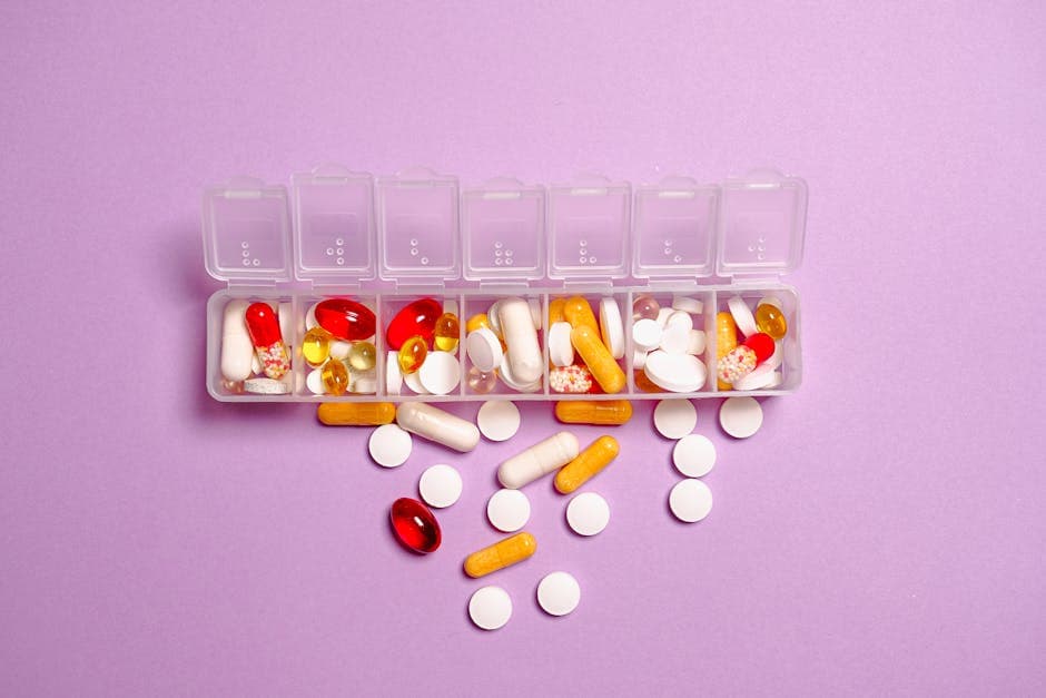 Person organizing daily supplement routine with capsules and a tracking app on the counter