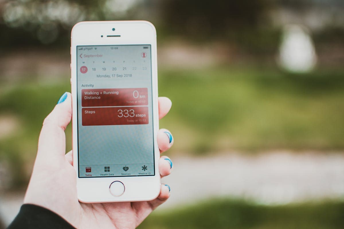 Smartphone displaying a health tracking app with a body map and injection site history