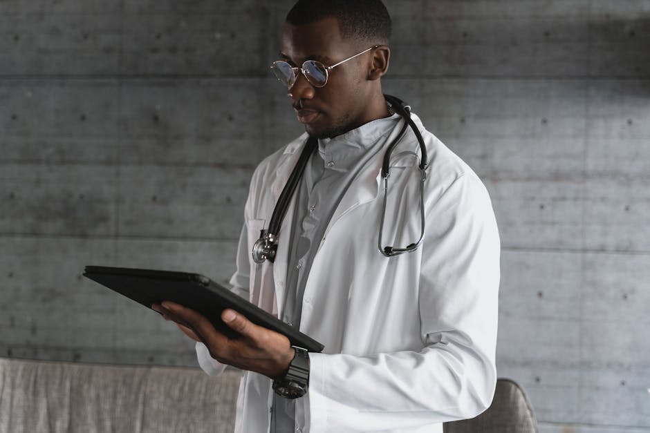 Medical professional reviewing patient health tracking data on a tablet