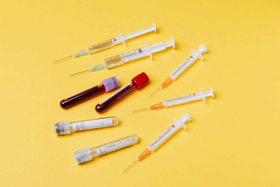 Medical syringes and test tubes arranged in an organized clinical layout